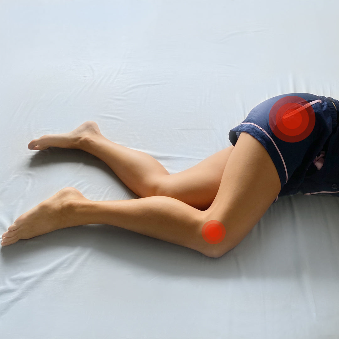 side sleeper woman not using Zleep's leg and knee pillow to prevent hip, lower back, sciatica and knee pain